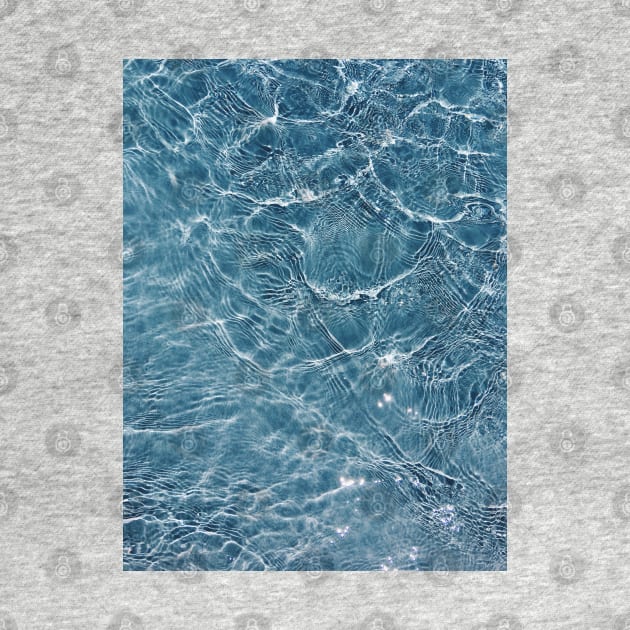 Photograph of water in blue swimming pool by keeplooping